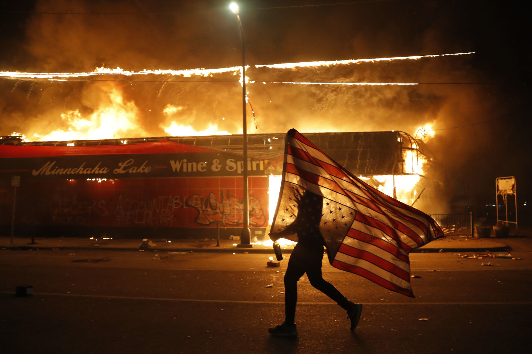 George Floyd protesters set Minneapolis police station afire